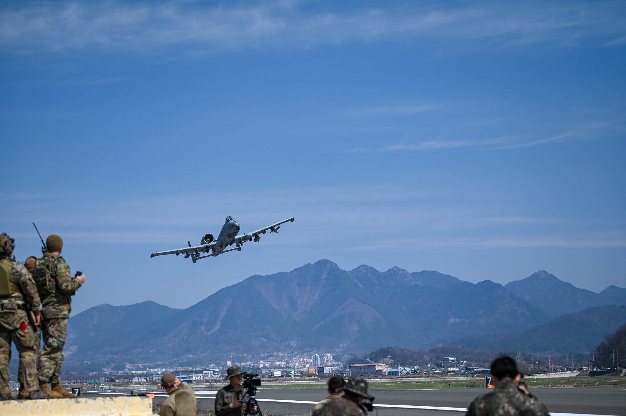 An A-10 Thunderbolt II “Warthog” from the 25th Fighter Squadron performs a low pass over an emergency landing site training event near Namji, Republic of Korea, March 13, 2024.