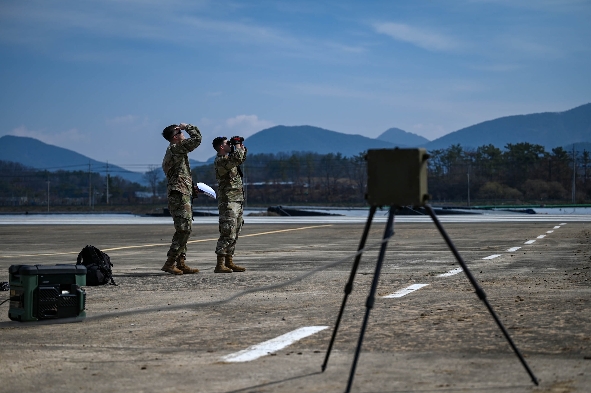 U.S. Air Force Staff Sgts. Race Gardner and. Anthony Thornton, 51st Operations Support Squadron weather craftsmen, monitor weather equipment at an emergency landing site training event near Namji, Republic of Korea, March 13, 2024.