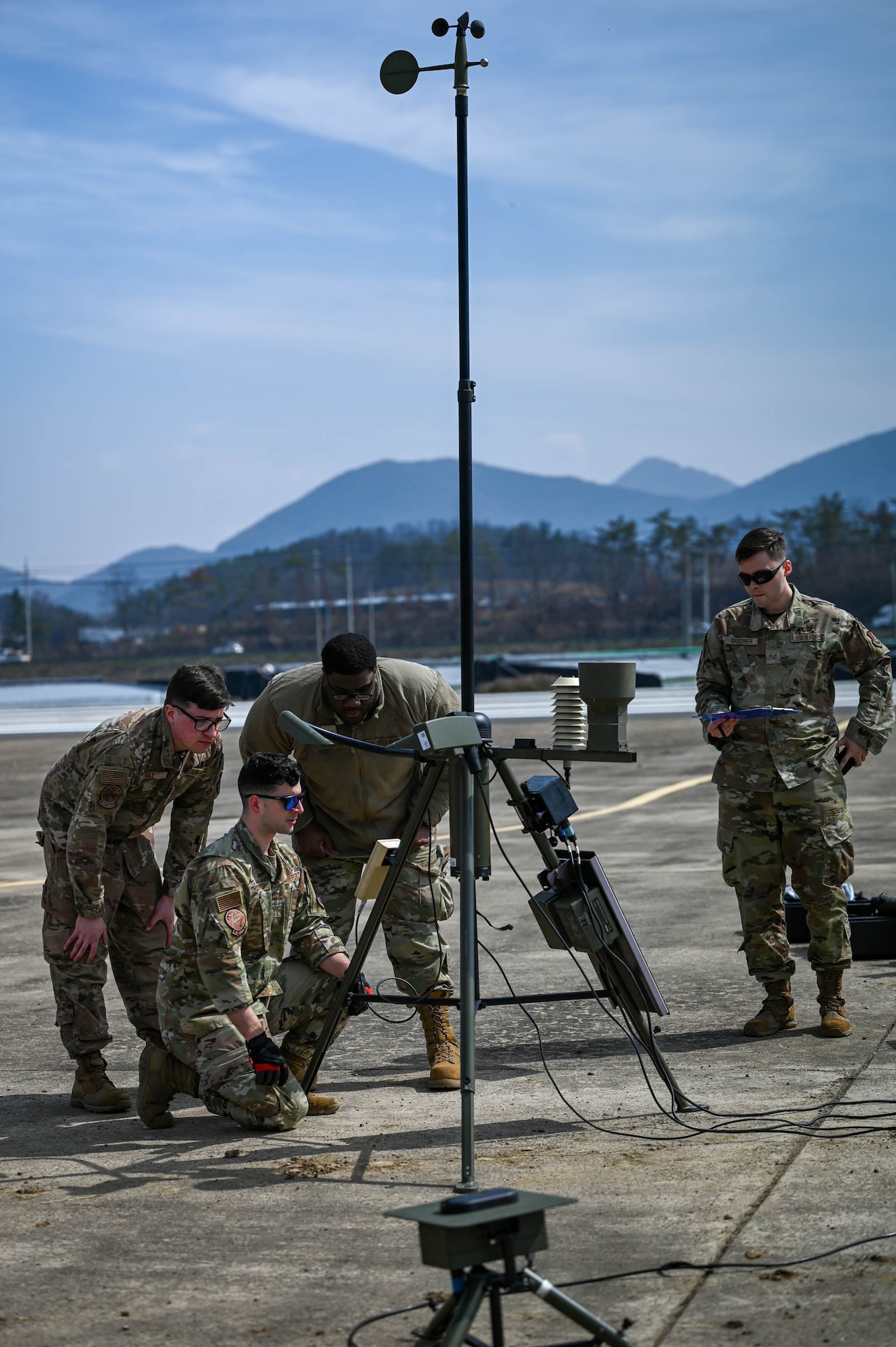 Airmen from the 51st Operations Support Squadron monitor weather equipment at an emergency landing site training event near Namji, Republic of Korea, March 13, 2024.