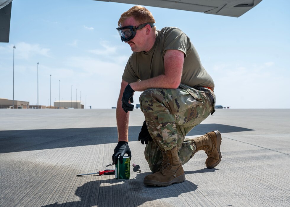 U.S. Air Force crew chief pulls picks up oil at an undisclosed location in the U.S. Central Command area of responsibility, Mar. 21, 2024. Crew chiefs are responsible for the maintenance and upkeep of aircraft, ensuring they are in optimal condition for missions. (U.S. Air Force photo)