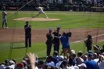 U.S. Marine Major Branden Koonce, commanding officer of Recruiting Station Chicago, left, and Sgt. Maj. Nathaniel Eirich, sergeant major of RS Chicago, are recognized by the Chicago Cubs, Chicago, IL, Sep. 6, 2024. The Chicago Cubs recognized Maj. Koonce and Sgt. Maj. Eirich as part of their second inning "Salute to Service". (U.S. Marine Corps Photo by Sgt. Dalton J. Payne)