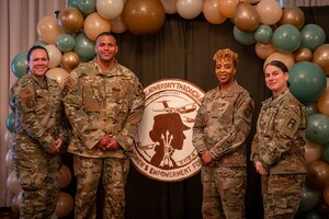 U.S. Air Force Lt Col. Katherine Harmon, Commander of the 305th Aircraft Maintenance Squadron, Master Sgt. Kristopher Mack, 6th Airlift Squadron Operations Superintendent, Chief Master Sgt. Andriea Cook, 305th Operations Group Senior Enlisted Leader, U.S. Army Lt Col. Jasmin Lirio, Battalion Commander for 1-315th Brigade Support Battalion, 174th Infantry Brigade, represent the panel members for the Women’s Empowerment forum at Joint Base McGuire-Dix-Lakehurst, N.J., March 18, 2024. The focus of this year’s event was Overcoming Adversity Through Advocacy. (U.S. Air Force photo by 2nd Lt. Alexis Kula)