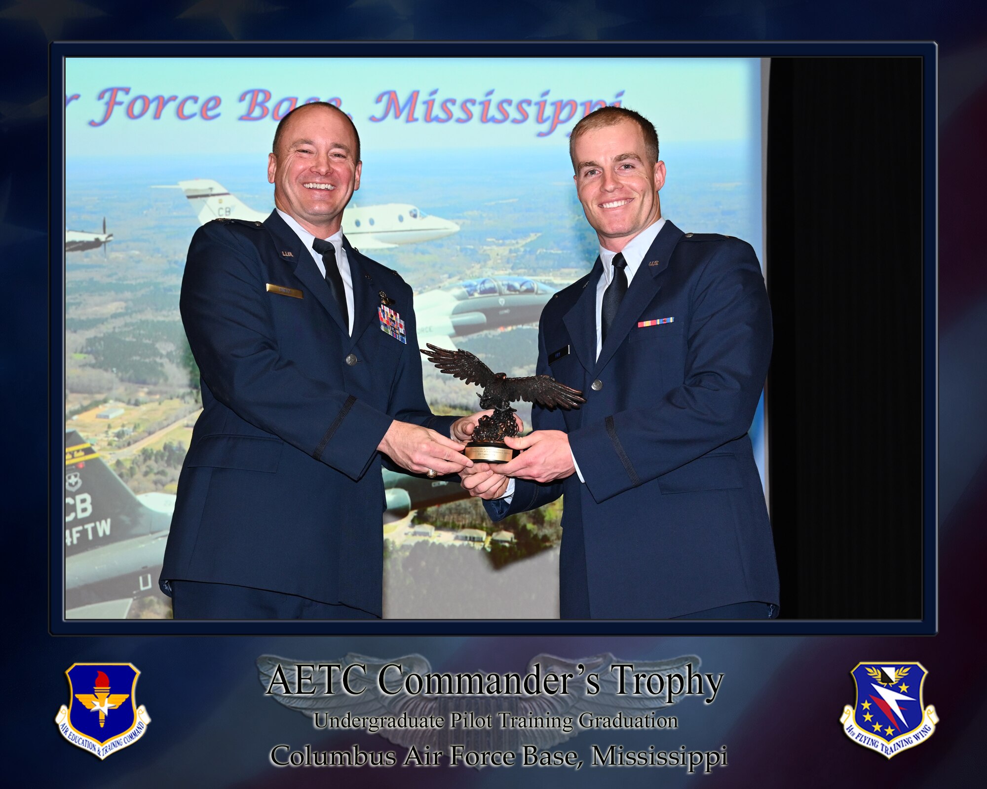 The AETC Commander's Trophy is present to 2nd Lt. Lance H. Fry.