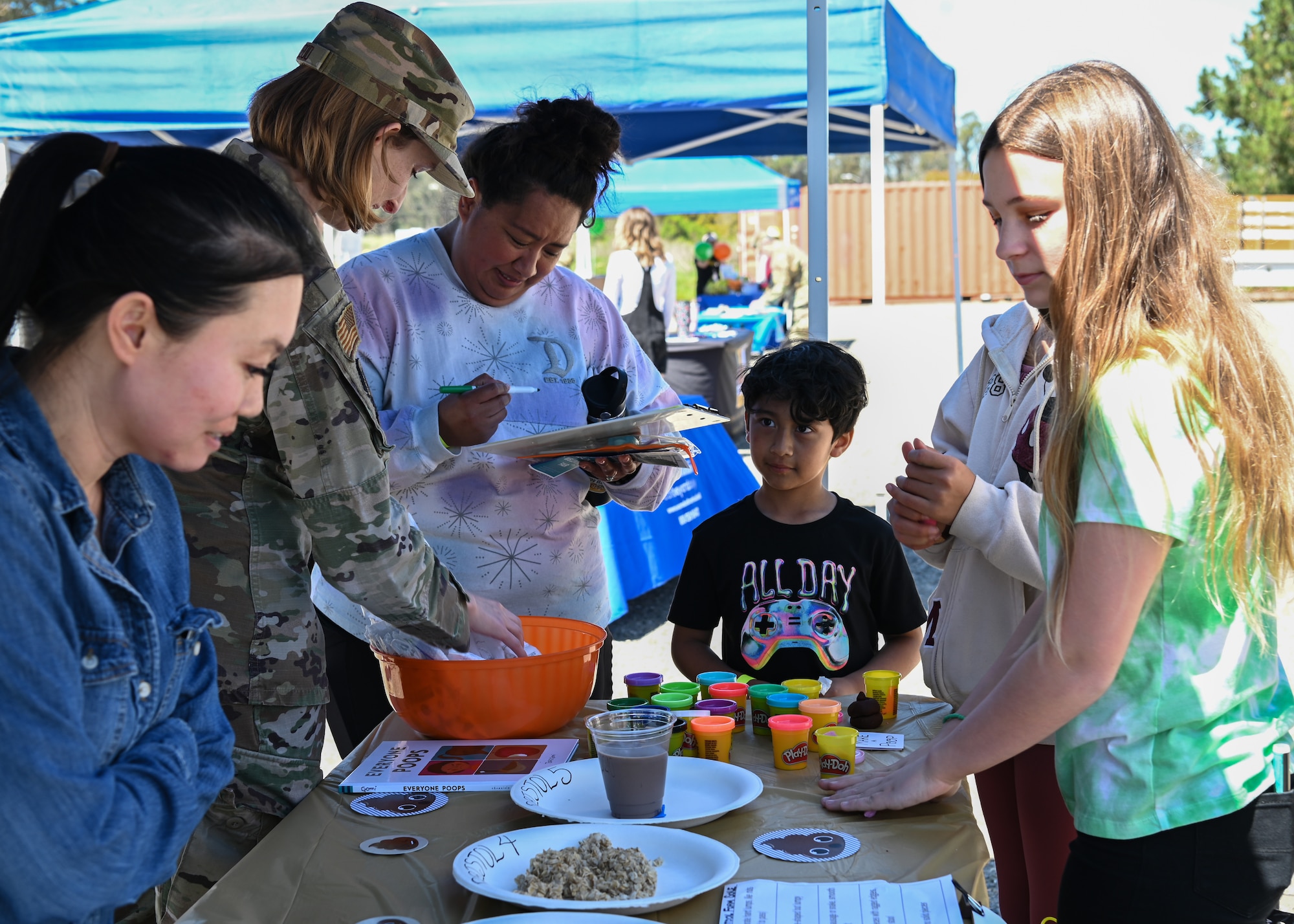 Vandenberg family members learn about the digestive system from 30th Medical Group personnel during the first 30th MDG Health Fair at Vandenberg Space Force Base.