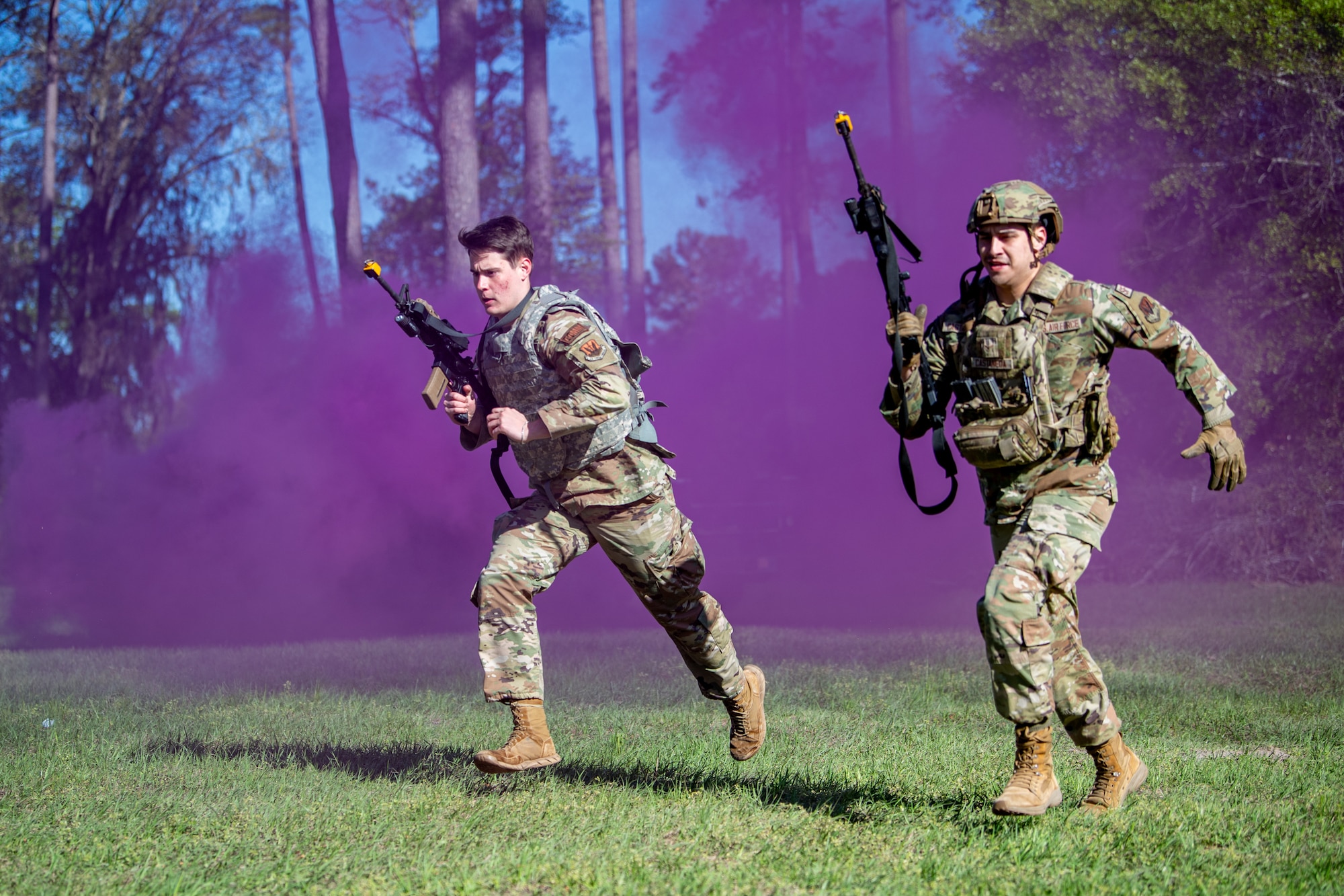 Airmen run during a readiness training exercise