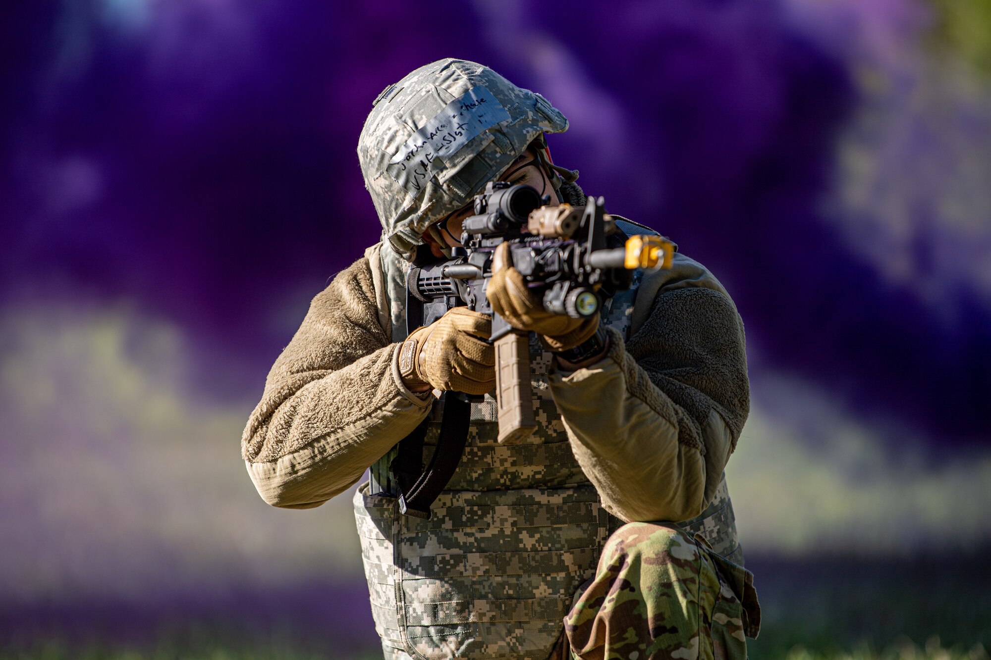 An Airmen practices simulated firing