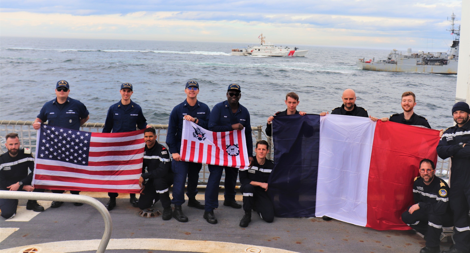 Crews from the Coast Guard Cutter Legare (WMEC 912) and the French naval ship Premier-Maître L’Her (F792) take a group photo aboard Legare, off the coast of Long Island, New York, on March 16, 2024. Legare worked with Premier-Maître L’Her for a series of engagements and exercises designed to demonstrate interoperability with a critical NATO partner