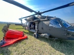 West Virginia National Guard personnel conduct aerial wildland firefighting sorties over Hardy County, West Virginia, on March 22, 2024. West Virginia Jim Justice declared a State of Emergency for four counties in the Eastern Panhandle of the Mountain State due to serious wildland fires that have consumed more than 4,000 acres of woodlands and threaten local communities and residences. Crews flying UH60M and HH60M Blackhawk helicopters from Company C, 1-150th Assault Battalion and Company C, 2-104th General Support Aviation Battalion are utilizing an aerial firefighting system called a “Bambi Bucket” capable of dropping up to 630 gallons of water on active fire lines per sortie to combat the blazes. The delivery method allows firefighters to contain or extinguish the fire in areas of rough and dangerous terrain that ground-based personnel could not safely or easily reach. (Courtesy Photo)