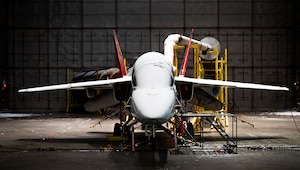 A T-7A Red Hawk sits in a frozen McKinley Climatic Lab chamber Jan. 22, 2024 at Eglin Air Force Base, Florida. The Air Force’s newest training aircraft experienced temperature extremes from 110 to minus 25 degrees Fahrenheit as well as heavy humidity during the month of testing. The tests evaluate how the aircraft, its instrumentation and electronics fared under the extreme conditions it will face in the operational Air Force. (U.S. Air Force photo by Samuel King Jr.)