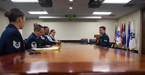 Airmen converse during a BTZ board.