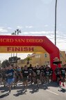 U.S. Marines and civilians with Marine Corps Recruit Depot San Diego kick-off the St. Patrick's Day 5k fun run at MCRD San Diego, California, March 15, 2024. The St. Patrick’s Day 5k fun run is one of many events hosted on the Depot designed to build unit morale and boost esprit de corps. (U.S. Marine Corps photo by Lance Cpl. Janell B. Alvarez)