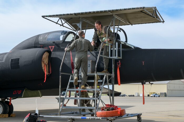 U.S. Air Force Maj. Andrew, 1st Reconnaissance Squadron pilot, greets Lt. Col. Michael, 410th Test and Evaluations Squadron director of operations, after flying TU-2s Dragon Lady 1078 from Palmdale, California, to Beale Air Force Base, California, March 21, 2024.
