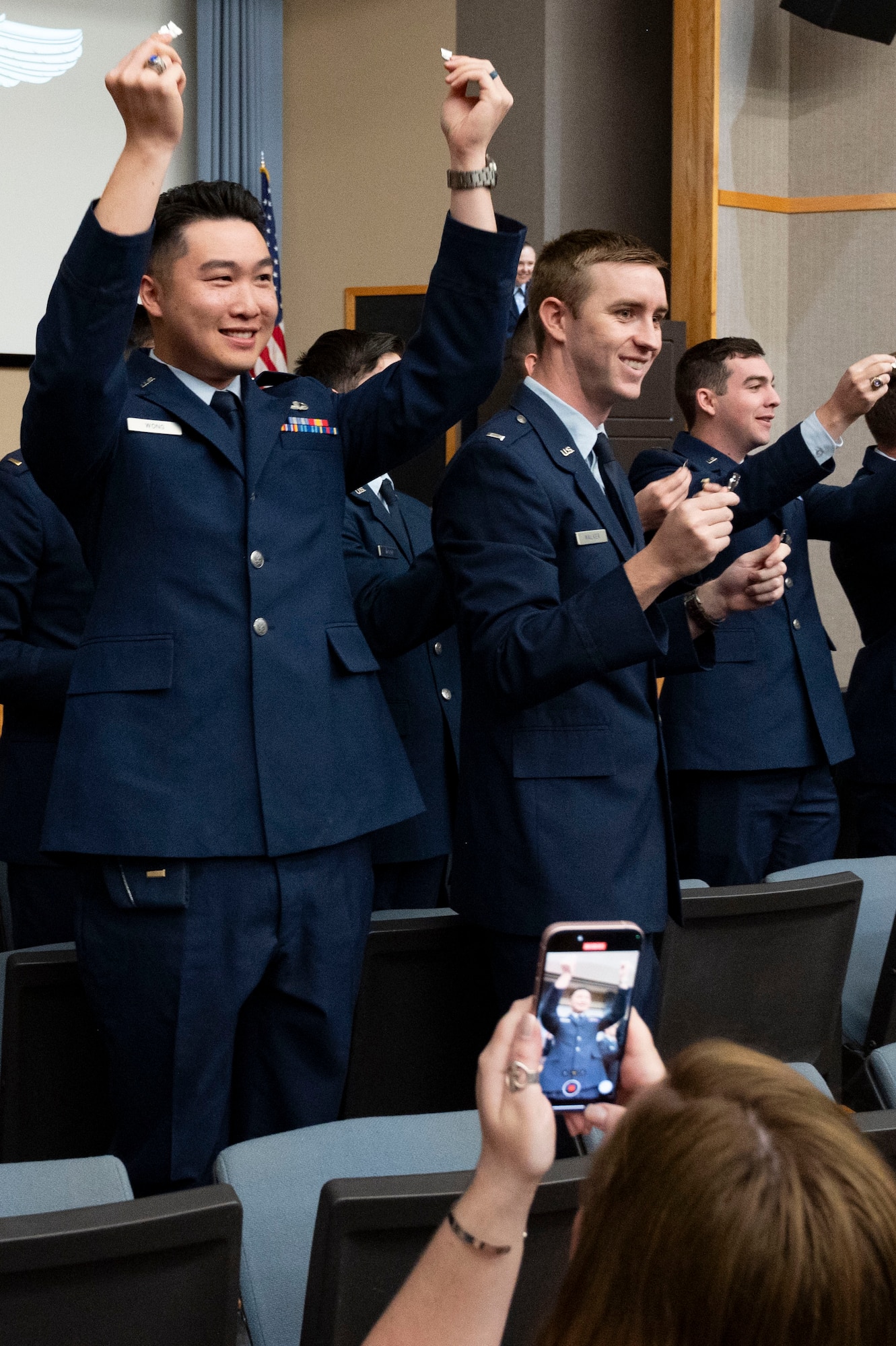 Student pilots of Class 24-07 Undergraduate Pilot Training hold up their broken wings during their graduation ceremony at Laughlin Air Force Base, Texas, March 22, 2024. The “breaking of the wings” is a tradition said to bring good fortune throughout a pilot’s career. One half of the wings is kept by the new pilot, and the other half is given to someone of significance in their lives. (U.S. Air Force photo by Senior Airmen Kailee Reynolds)