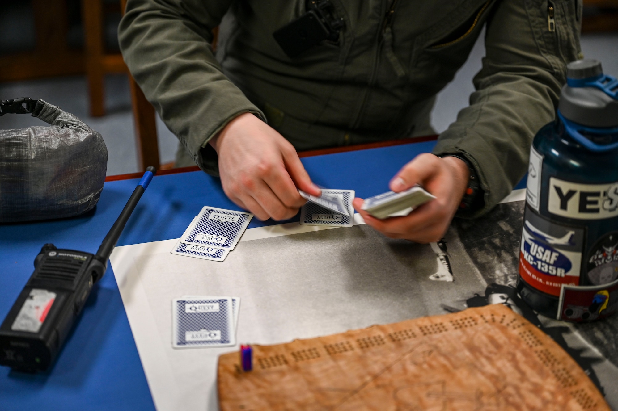 Airman deals cards