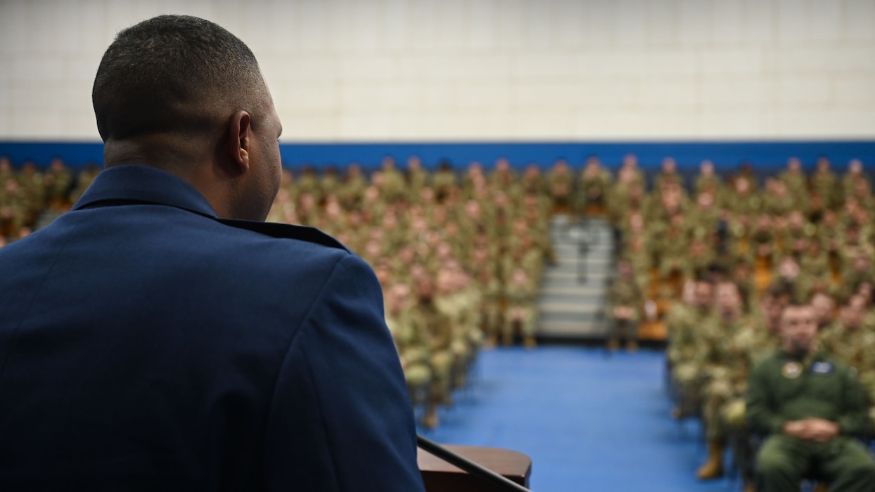 U.S. Air Force Lt. Col. Jahmal Edwards, 316th Training Squadron commander, speaks during the 316th TRS Plaque Dedication Ceremony to honor Technical Sgt. Ernest R. Parrish and Staff Sgt. Jacob M. Galliher, at the Mathis Gymnasium, Goodfellow Air Force Base, Texas, March 15, 2024. Parrish and Galliher were both airborne cryptologic language analysts trained at the Goodfellow Air Force Base, Texas. (U.S. Air Force photo by Airman 1st Class Evelyn J. D’Errico)