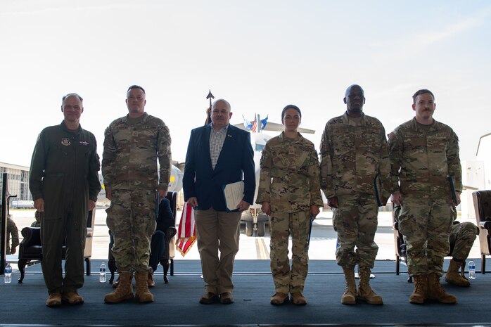 Airmen pose for a photo.