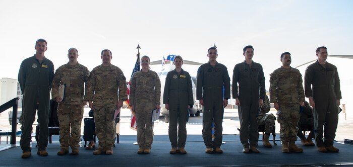 Airmen pose for a photo.