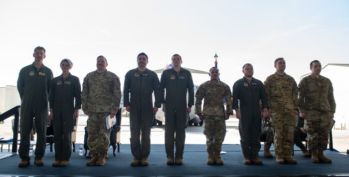 Airmen pose for a photo.