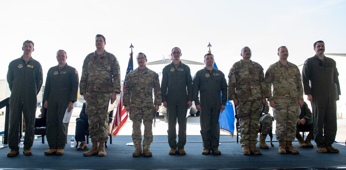 Airmen pose for a photo.