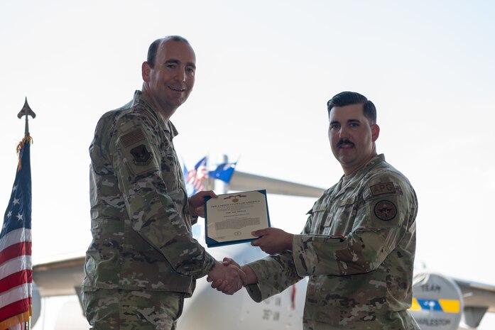 Airmen pose for a photo.
