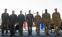 Airmen pose for a photo.