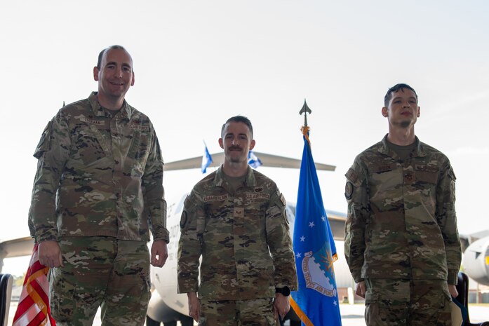 Airmen pose for a photo.