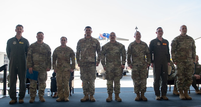 Airmen pose for a photo.