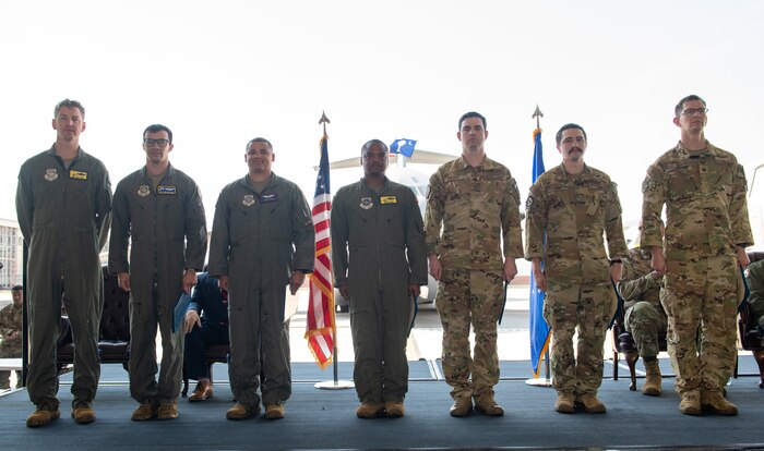 Airmen pose for a photo.