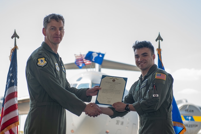 Airmen pose for a photo.