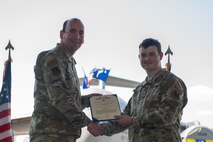 Airmen pose for a photo.