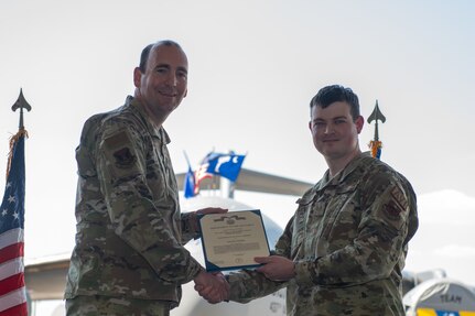 Airmen pose for a photo.