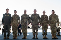 Airmen pose for a photo.