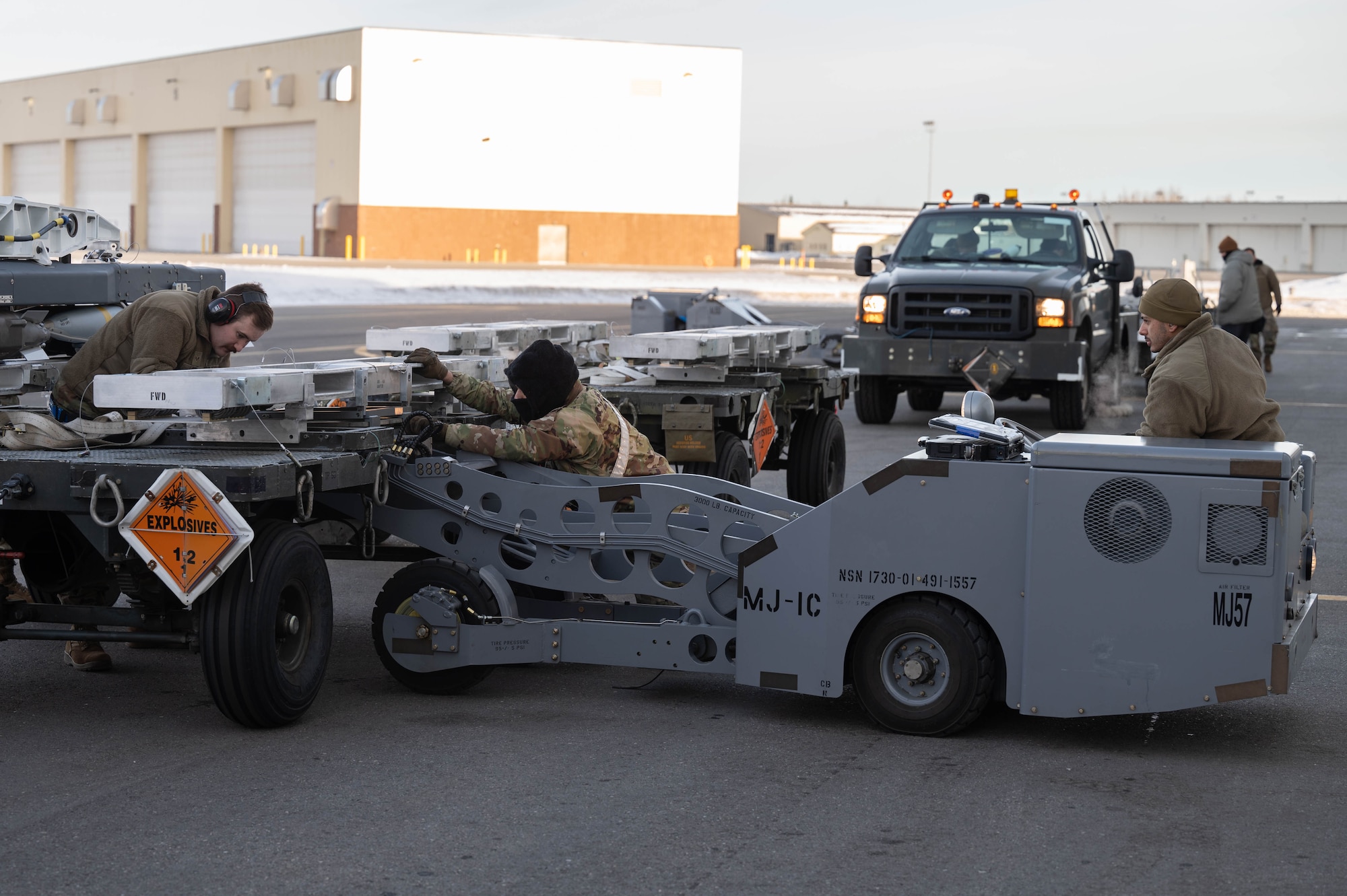 Airmen assigned to the 355th Fighter Generation Squadron prepare to load armament during Arctic Gold 24-2 at Eielson Air Force Base, Alaska, March 20, 2024.