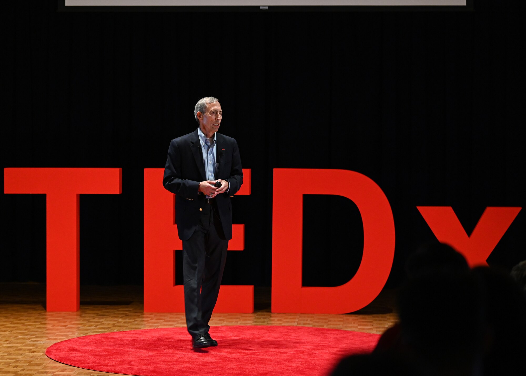 A man speaks during a conference.