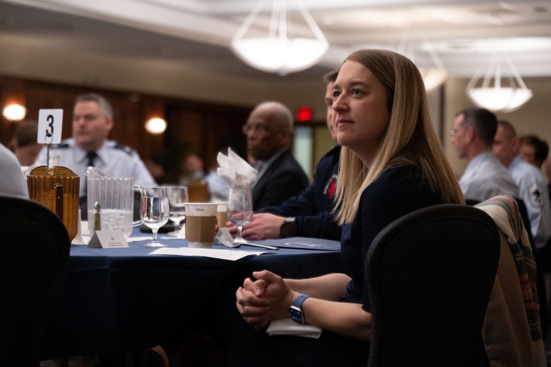 Melissa Jenkins, Washington Nationals vice president of strategic partnerships, listens to speakers during the honorary commander induction ceremony at Joint Base Andrews, Md., March 21, 2024.