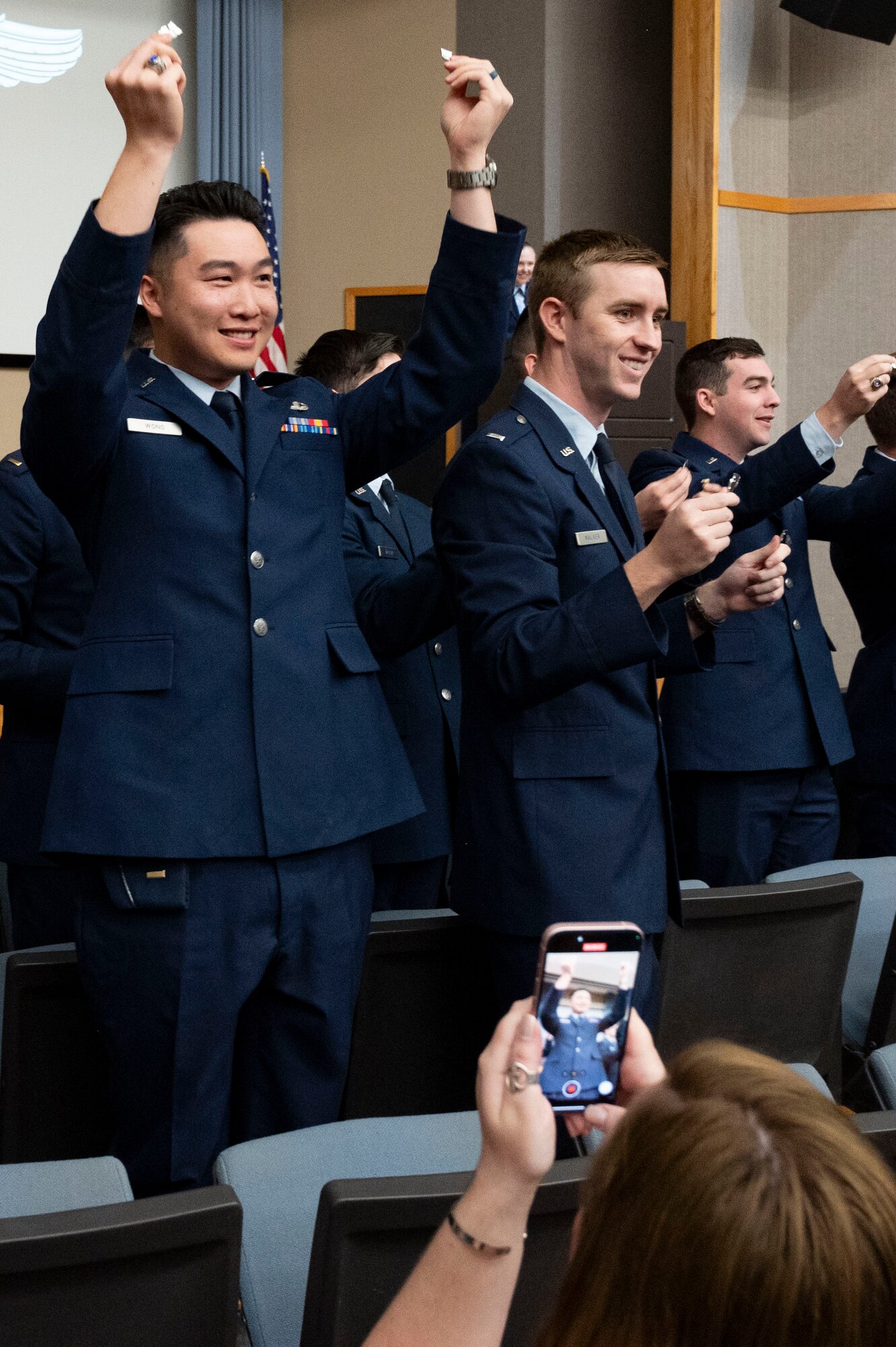 Student pilots of Class 24-07 Undergraduate Pilot Training hold up their broken wings during their graduation ceremony at Laughlin Air Force Base, Texas, March 22, 2024. The “breaking of the wings” is a tradition said to bring good fortune throughout a pilot’s career. One half of the wings is kept by the new pilot, and the other half is given to someone of significance in their lives. (U.S. Air Force photo by Senior Airmen Kailee Reynolds)