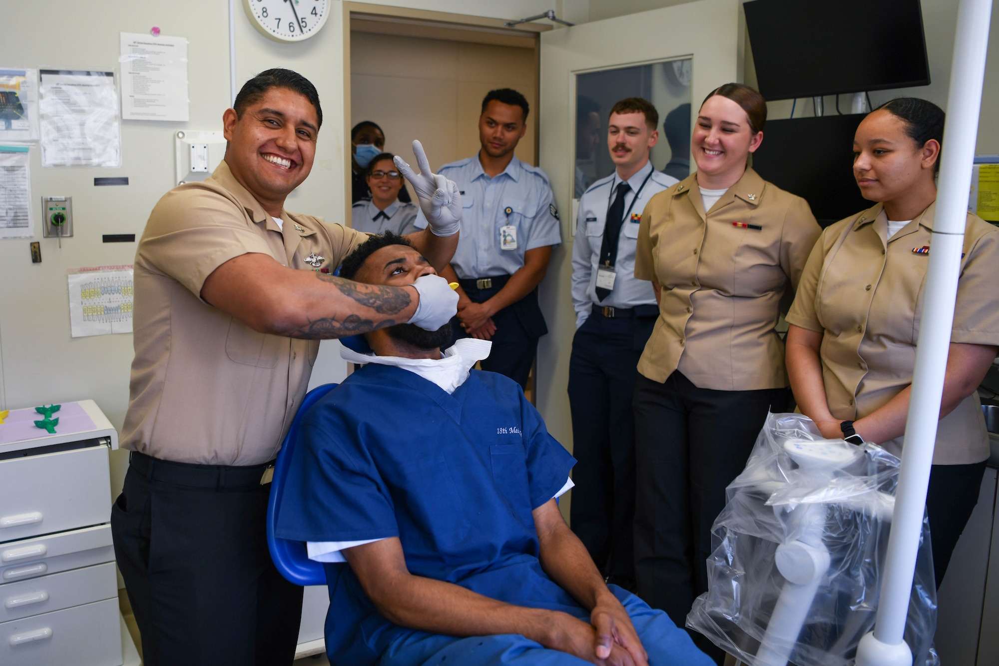 U.S. Navy service members and U.S. Air Force airmen participate in a dental exercise.
