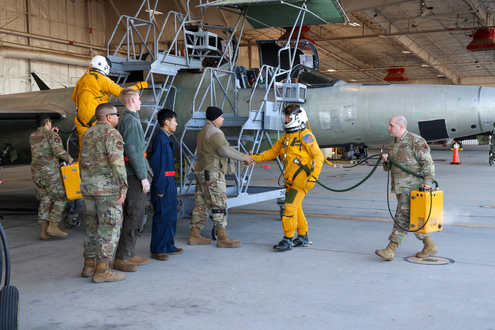 U.S. Air Force Maj. Brandon, Air Force Life Cycle Management Center (AFLCMC) Detachment 4 chief of flight test operations, shakes hands with the maintenance crew of TU-2S Dragon Lady 1078 before aircraft 1078’s first high flight after almost three years of maintenance at Beale Air Force Base, California, Feb. 22, 2024