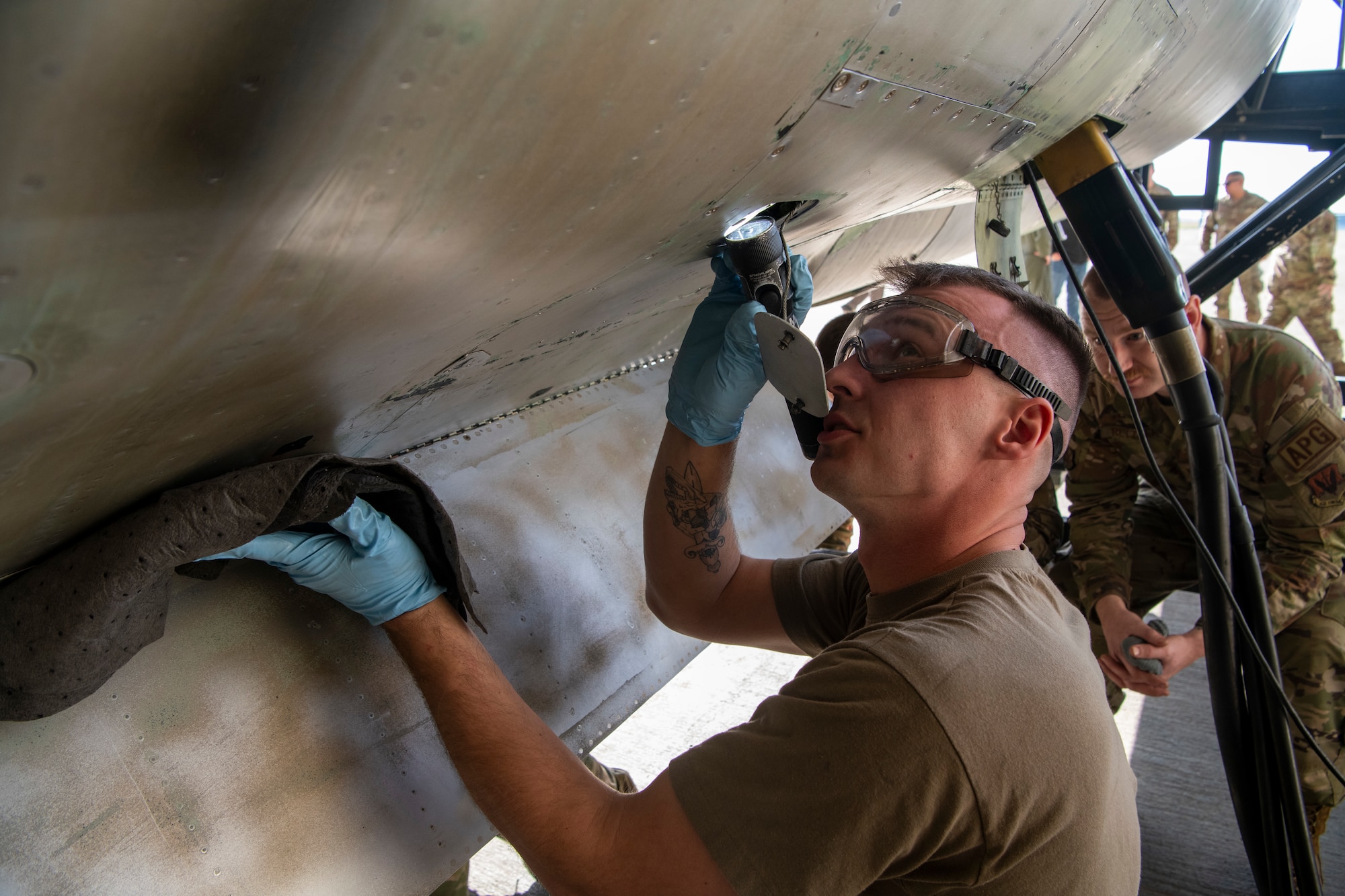 U.S. Air Force Staff Sgt. Brooklynn Bellamy, 9th Aircraft Maintenance Squadron U-2 Dragon Lady crew chief, ensures proper fluid levels inside of TU-2S Dragon Lady 1078 after almost three years of maintenance to restore the two-seater U-2 at Beale Air Force Base, California, Jan. 25, 2024