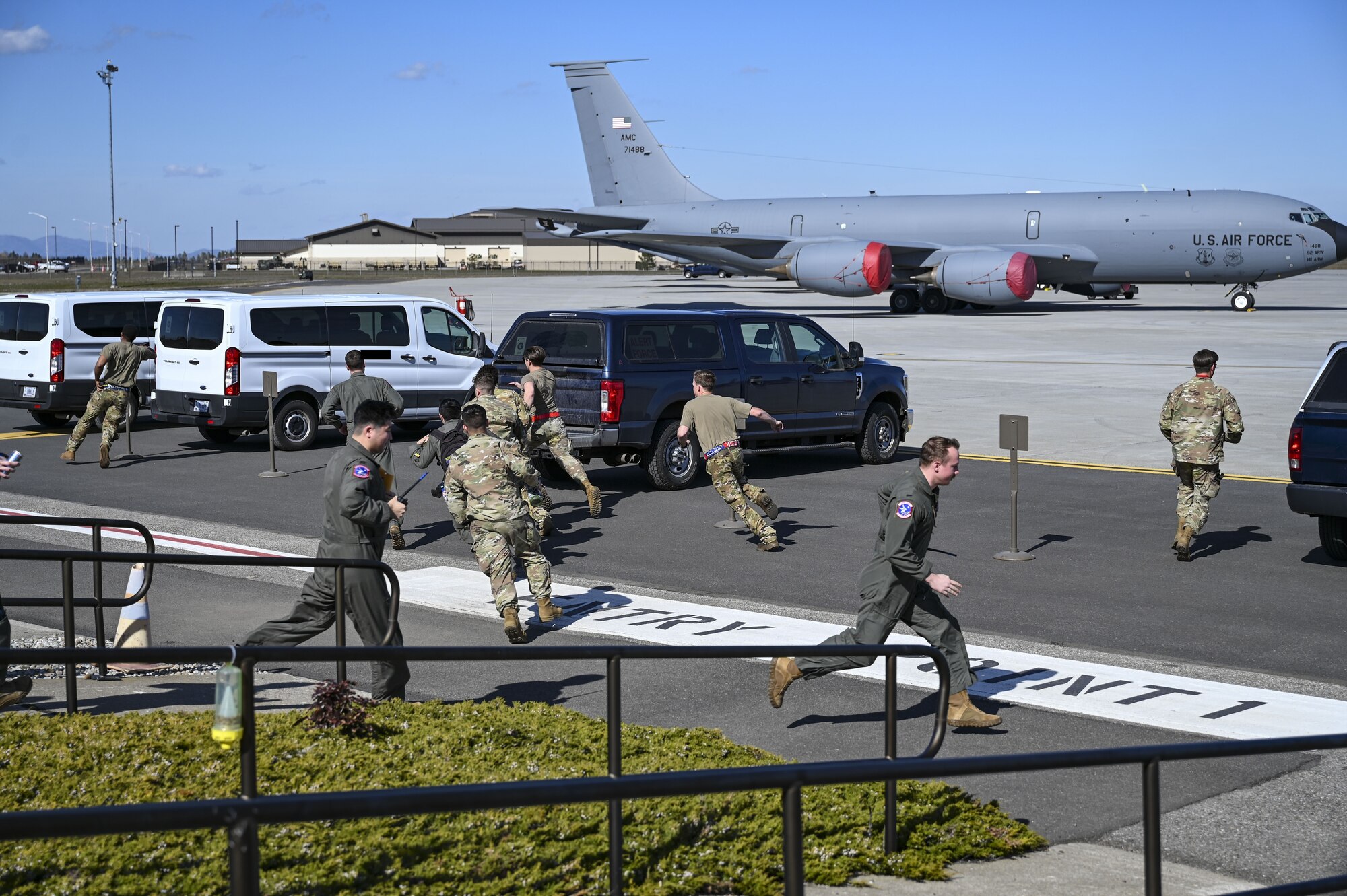 Airmen run to vehicles