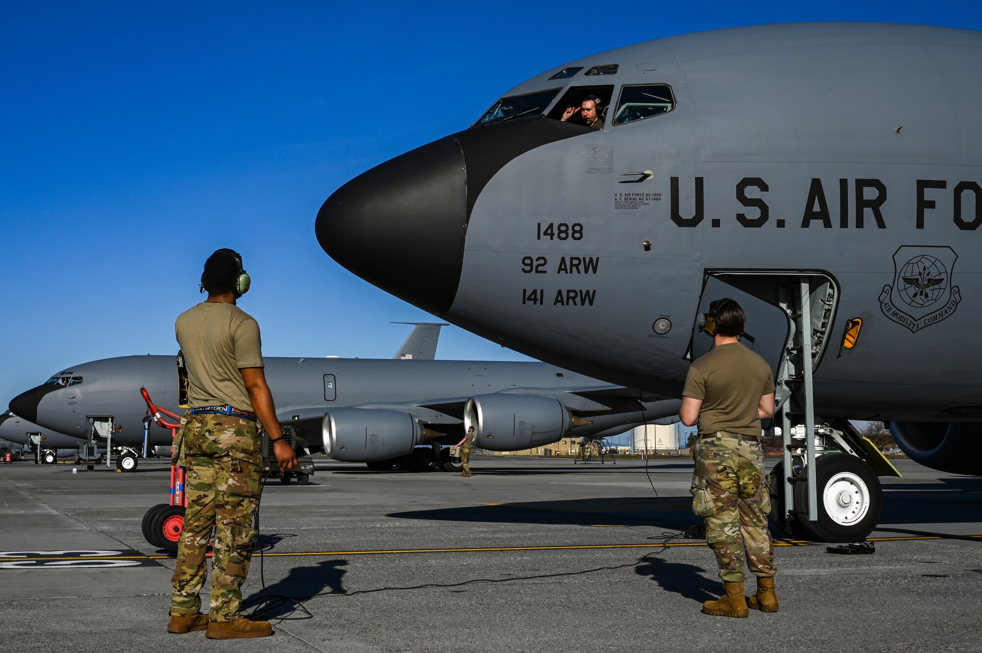 Airmen coordinate with pilot