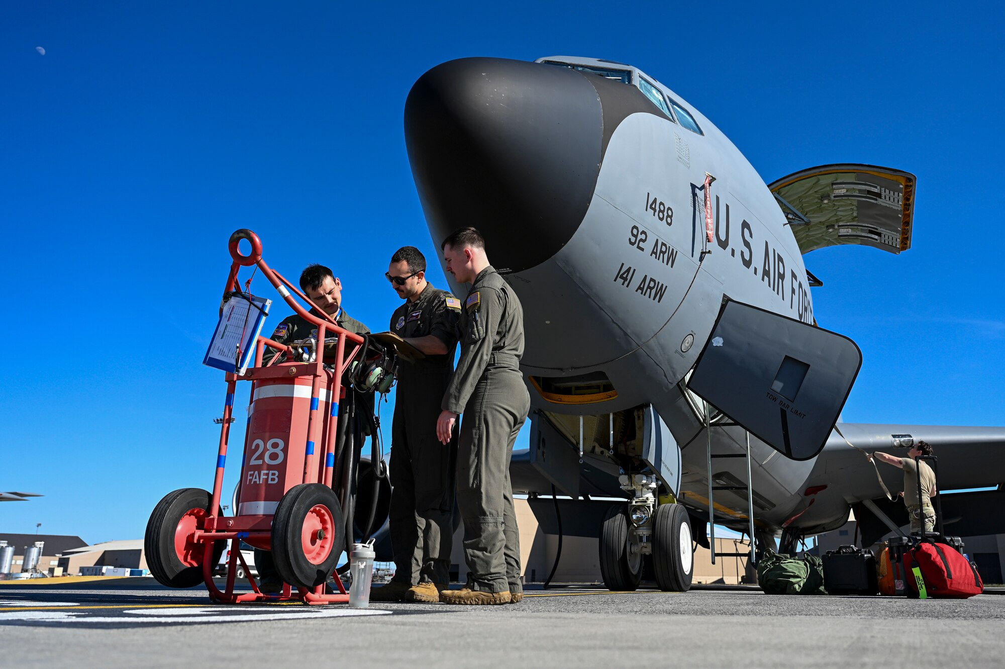 Airmen coordinate with pilot