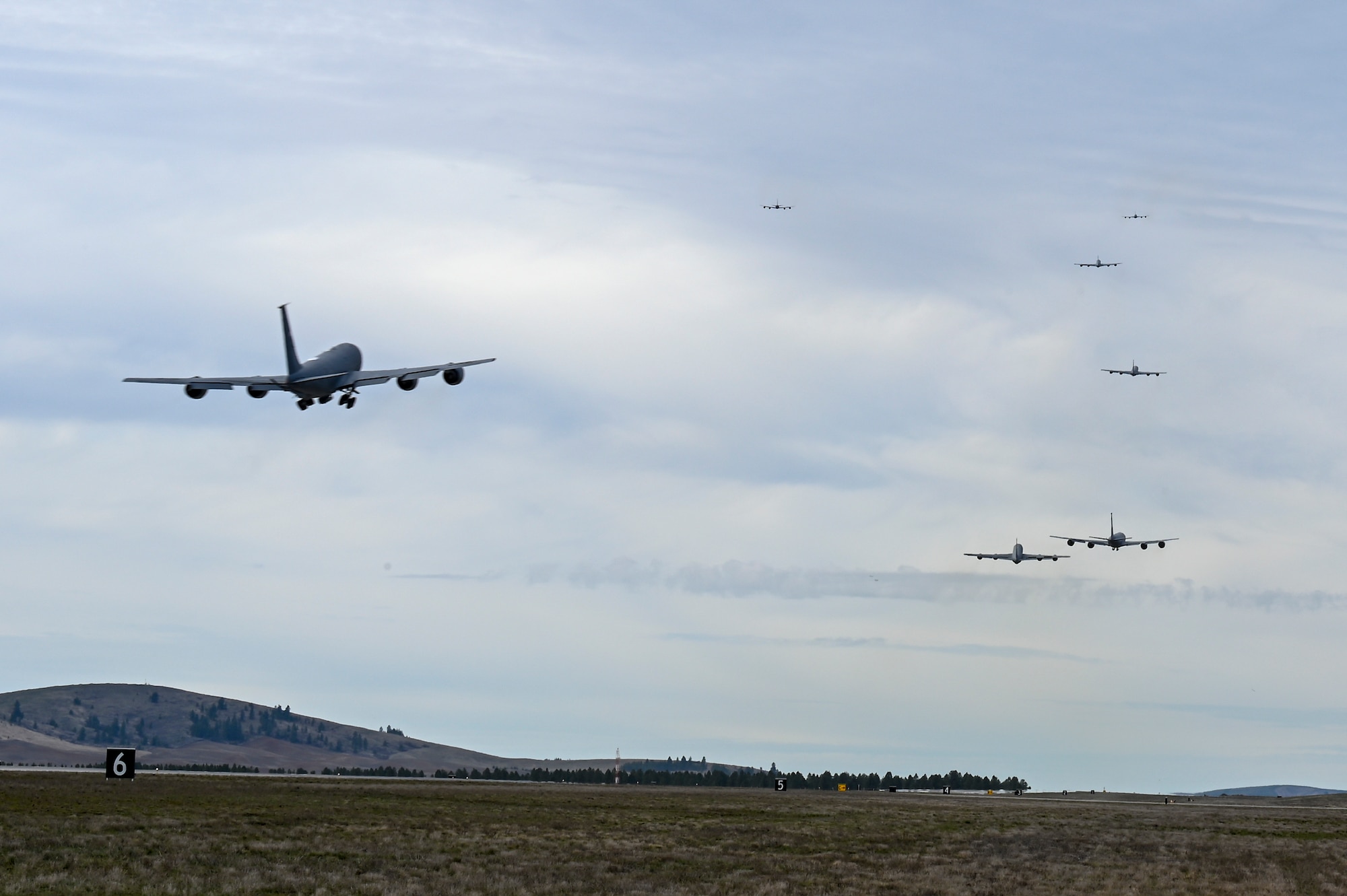 KC-135 Stratotankers flying into the distance
