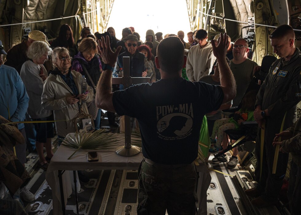 U.S. Air Force Capt. Adam Roe, 56th Fighter Wing chaplain, provides a Palm Sunday service in a C-130J Super Hercules aircraft assigned to the 317th Airlift Wing, Dyess Air Force Base, during the Luke Days airshow on March 24, 2024, at Luke Air Force Base, Arizona.