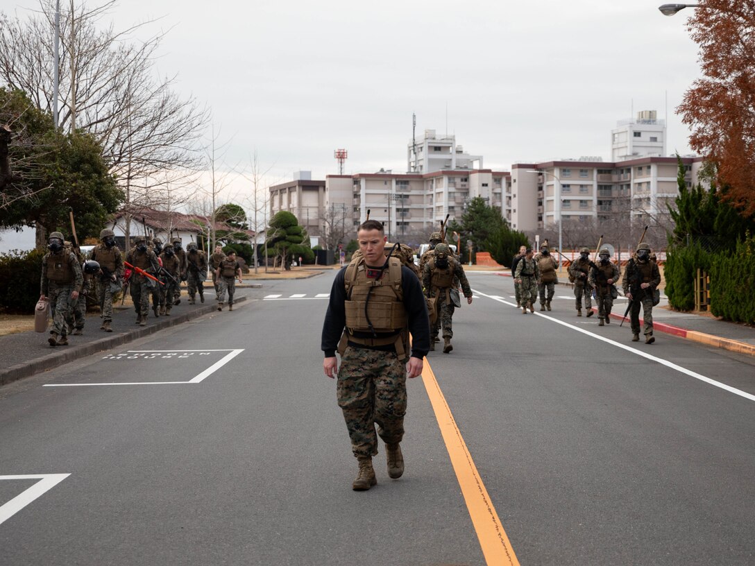 U.S. Marine Corps Gunnery Sgt. Mikael Marcy, a brig supervisor with Headquarters and Headquarters Squadron, Marine Corps Air Station Iwakuni, instructs a group of Marines during the culminating event of a Marine Corps martial arts instructor course at MCAS Iwakuni, Japan, Dec. 14, 2023. Graduates of the 15-day course become qualified Martial Arts Instructors, empowered to independently lead and facilitate courses, assisting lower-belt Marines in their progression towards higher belts. (U.S. Marine Corps photo by Lance Cpl. Colin Thibault)