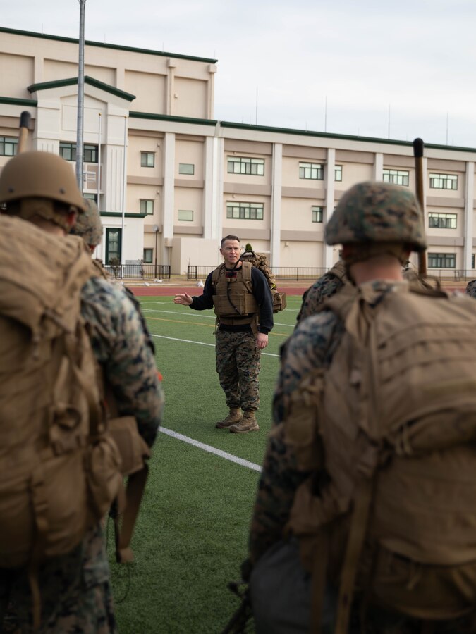 U.S. Marine Corps Gunnery Sgt. Mikael Marcy, a brig supervisor with Headquarters and Headquarters Squadron, Marine Corps Air Station Iwakuni, instructs a group of Marines during the culminating event of a Marine Corps martial arts instructor course at MCAS Iwakuni, Japan, Dec. 14, 2023. Graduates of the 15-day course become qualified Martial Arts Instructors, empowered to independently lead and facilitate courses, assisting lower-belt Marines in their progression towards higher belts. (U.S. Marine Corps photo by Lance Cpl. Colin Thibault)
