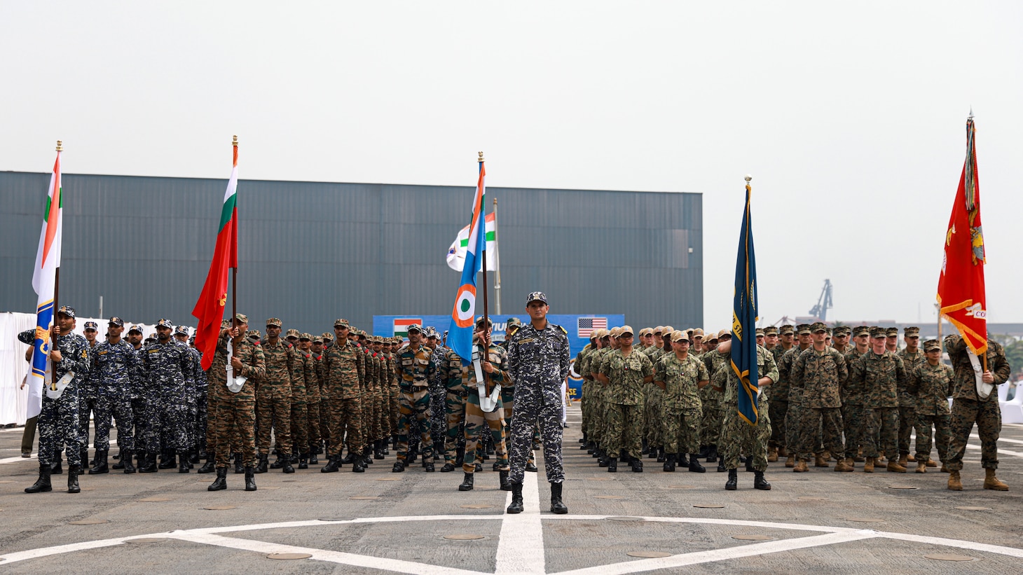 Republic of India service members, U.S. Marines assigned to the 15th Marine Expeditionary Unit, and Sailors assigned to the amphibious transport dock USS Somerset (LPD 25), stand together in formation during the opening ceremony of Exercise Tiger TRIUMPH in Visakhapatnam, India, March 19, 2024. Tiger TRIUMPH is a U.S.-India tri-service amphibious exercise focused on humanitarian assistance and disaster relief readiness and interoperability. Tiger TRIUMPH enables U.S. and Indian Armed Forces to improve interoperability and bilateral, joint, and service readiness in the Indian Ocean region and beyond to better achieve mutual regional security objectives. (U.S. Marine Corps photo by Cpl. Aidan Hekker)