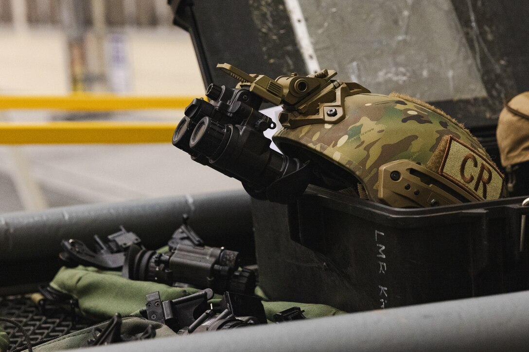 A pair of Gen III AN/AVS-9 night vision goggles are staged during a training exercise at Marine Corps Air Station Iwakuni, Japan, Dec. 13, 2023. The U.S. Air Force 36th Contingency Response Group conducted joint training that focused on equipment and process interoperability in a contested logistics environment with the MCAS Iwakuni Headquarters and Headquarters Squadron Logistics Department and members of the Japan Air Self-Defense Force.  (U.S. Marine Corps photo by Cpl. Darien Wright)