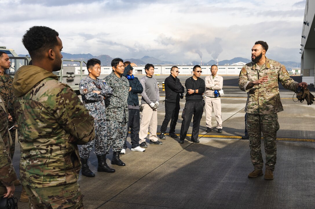 U.S. Air Force Staff Sgt. Juan Martinez, a fuels specialist with the U.S. Air Force 36th Contingency Response Squadron, 36th Contingency Response Group, gives a class on fuel distribution and transportation during a training exercise at MCAS Iwakuni, Japan, Dec. 12, 2023. The U.S. Air Force 36th Contingency Response Group conducted joint training that focused on equipment and process interoperability in a contested logistics environment with the MCAS Iwakuni Headquarters and Headquarters Squadron Logistics Department and members of the Japan Air Self-Defense Force.  (U.S. Marine Corps photo by Cpl. Darien Wright)