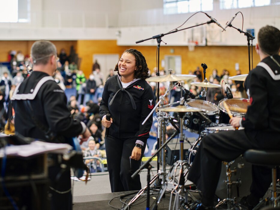 The U.S. Seventh Fleet Band's Musician 2nd Class Ashley Pollock laughs with her Orient Express bandmates at the 28th Annual Yokosuka Spring Festival at Commander, Fleet Activities Yokosuka's Purdy Fitness Center Saturday, March 23, 2024.